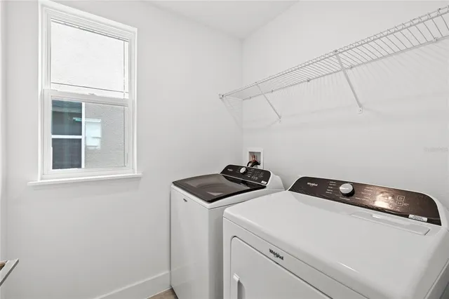 a utility room with dryer and washer