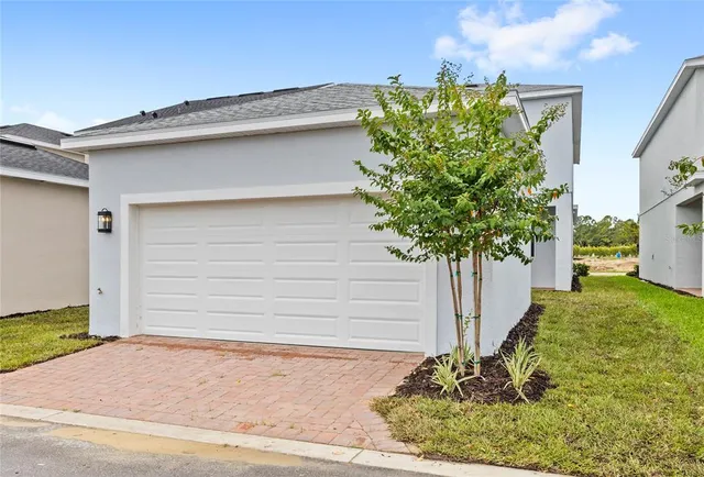 a house with a tree in front of it