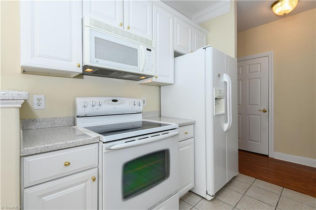 522 College Road Greensboro, NC 27410 - Photo 16 of 36 Another view of the kitchen with solid surface countertops