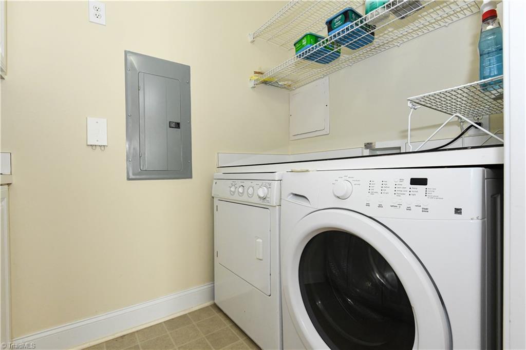 522 College Road Greensboro, NC 27410 - Photo 18 of 36 More shelving above the washer/dryer.