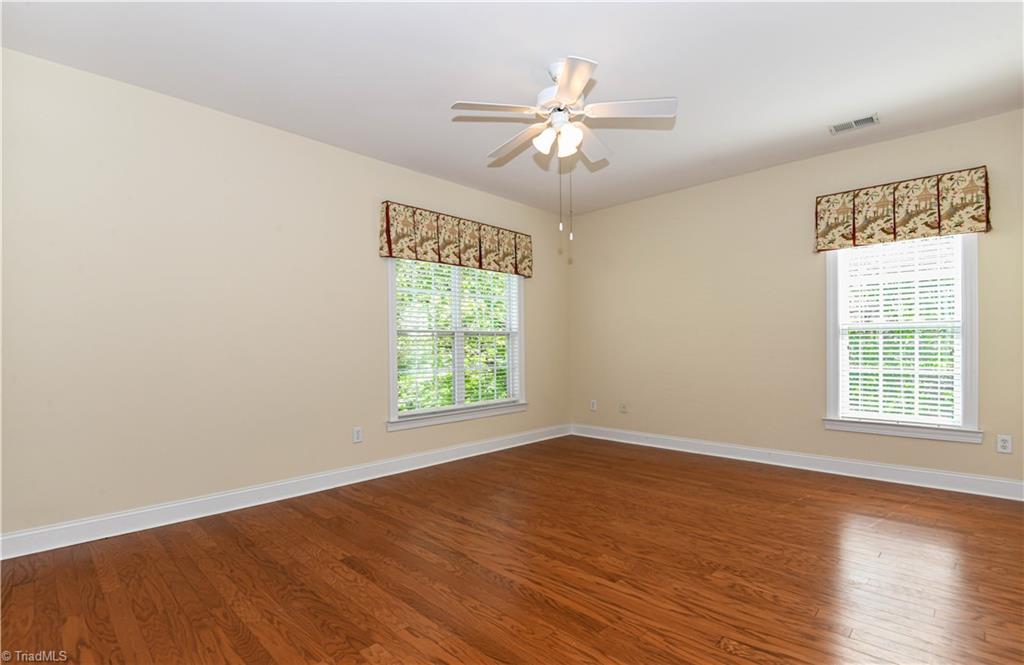 522 College Road Greensboro, NC 27410 - Photo 19 of 36 Primary Bedroom - located at the back of the unit - looks out over trees/foliage