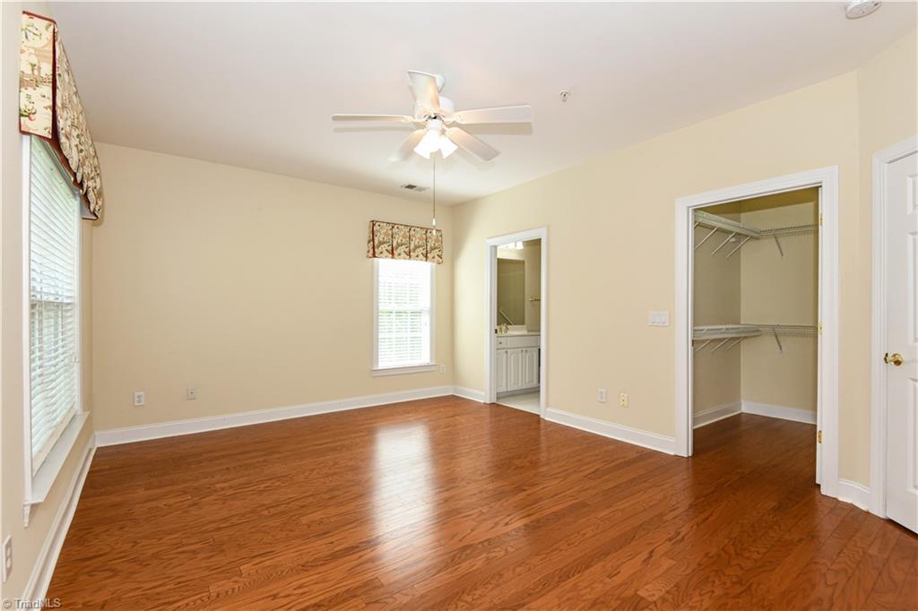 522 College Road Greensboro, NC 27410 - Photo 20 of 36 Primary Bedroom - looking into the large walk-in closet and primary bath