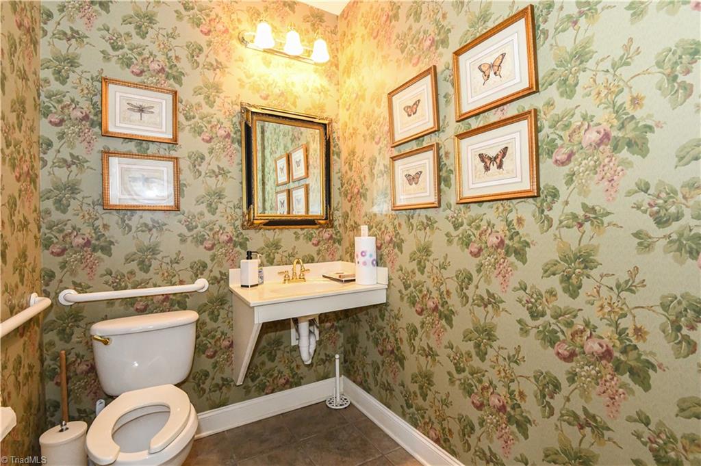 522 College Road Greensboro, NC 27410 - Photo 32 of 36 One of two of the half baths in the clubhouse