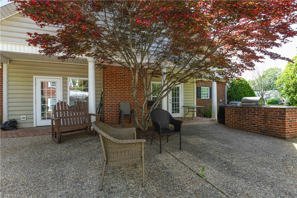 522 College Road Greensboro, NC 27410 - Photo 34 of 36 Who would not want to come out here to sit and enjoy the surroundings and/or plan on grilling out? This clubhouse has it all.