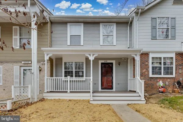 a front view of a house with a porch