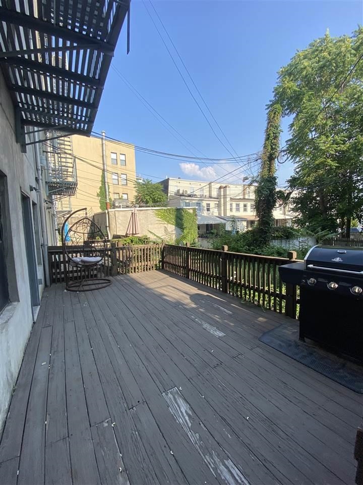 409 1st Street, Unit A Hoboken, NJ 07030 - Photo 8 of 10 a view of a balcony with wooden floor