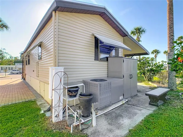 a view of a patio with table and chairs