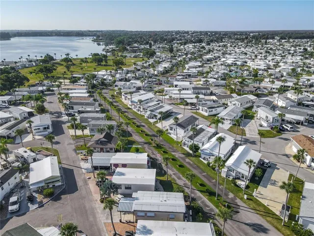 a aerial view of a dining tables and chairs in the ocean