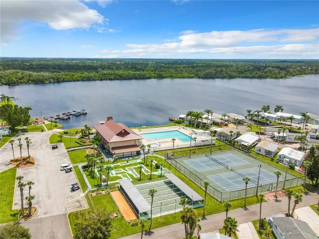 an aerial view of a house with a lake view