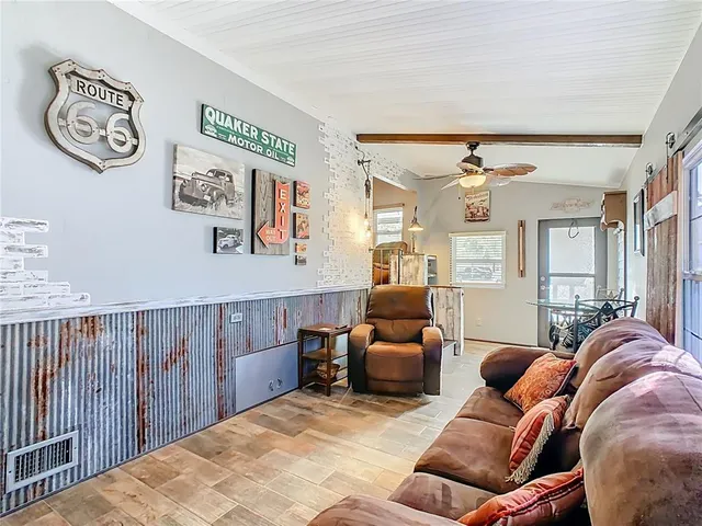 a bedroom with furniture and a chandelier