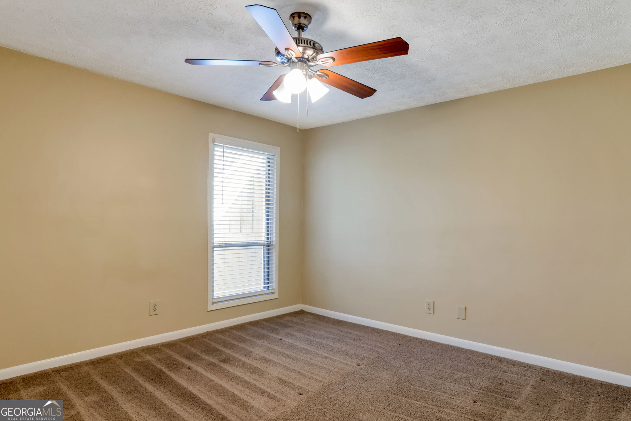 5155 Roswell Road, Unit 9 Atlanta, GA 30342 - Photo 14 of 20 an empty room with windows and fan