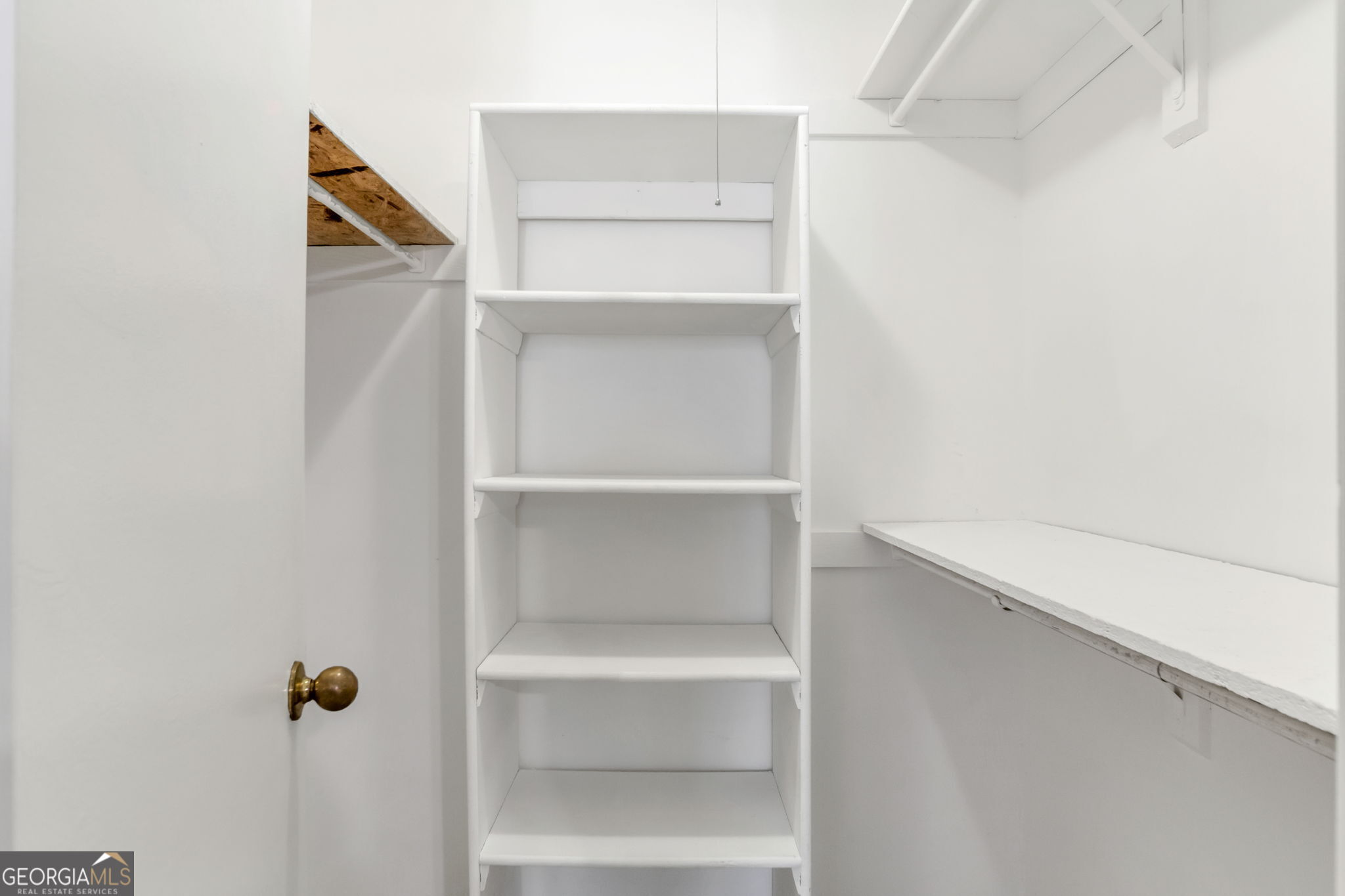 5155 Roswell Road, Unit 9 Atlanta, GA 30342 - Photo 17 of 20 a view of walk in closet with empty racks