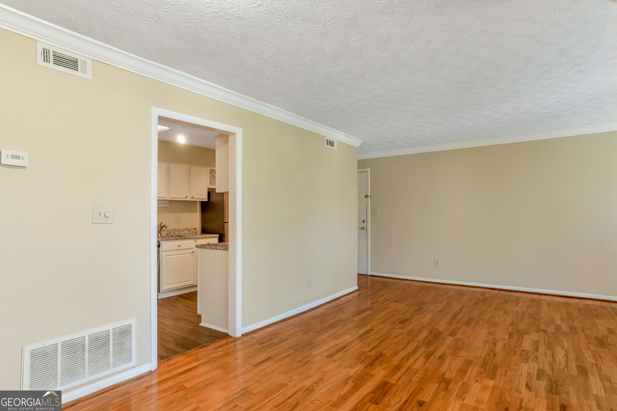 5155 Roswell Road, Unit 9 Atlanta, GA 30342 - Photo 5 of 20 wooden floor in an empty room