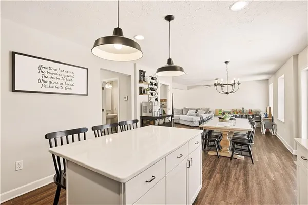 a very nice looking dining room with a table and chairs