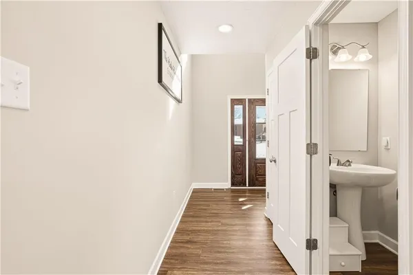 a view of a bathroom with sink and mirror