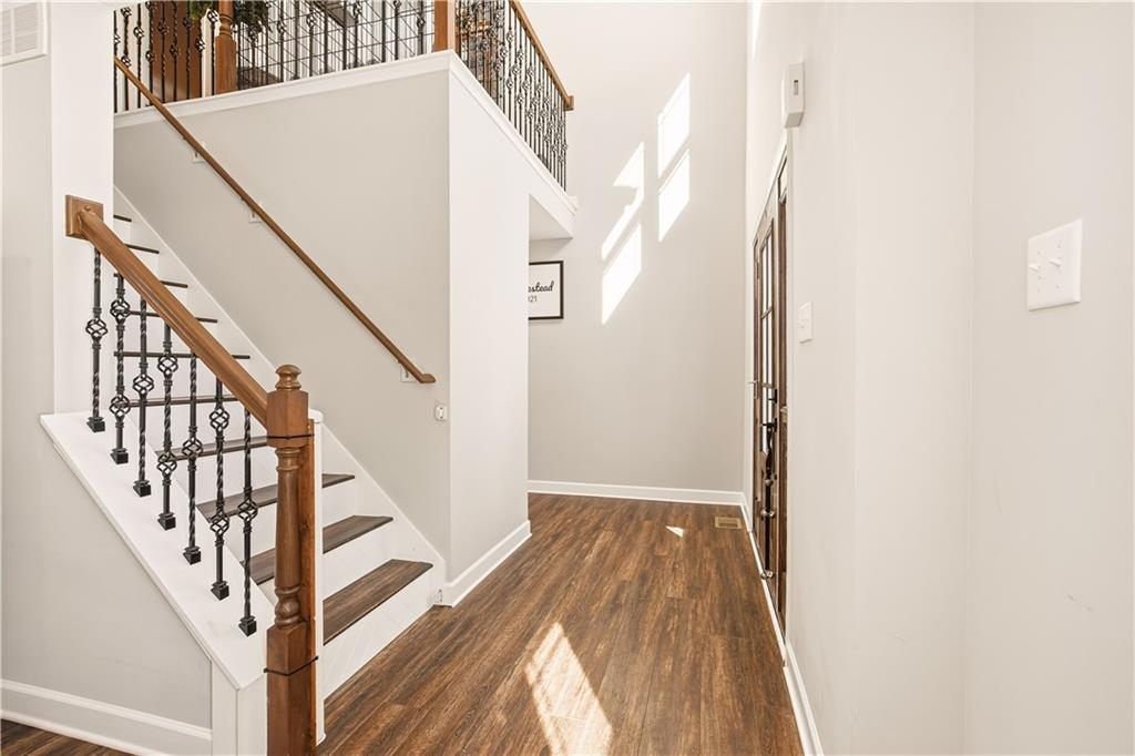 3106 Upper Ridgeview Road Connellsville, PA 15425 - Photo 19 of 44 a view of staircase with wooden floor and white walls