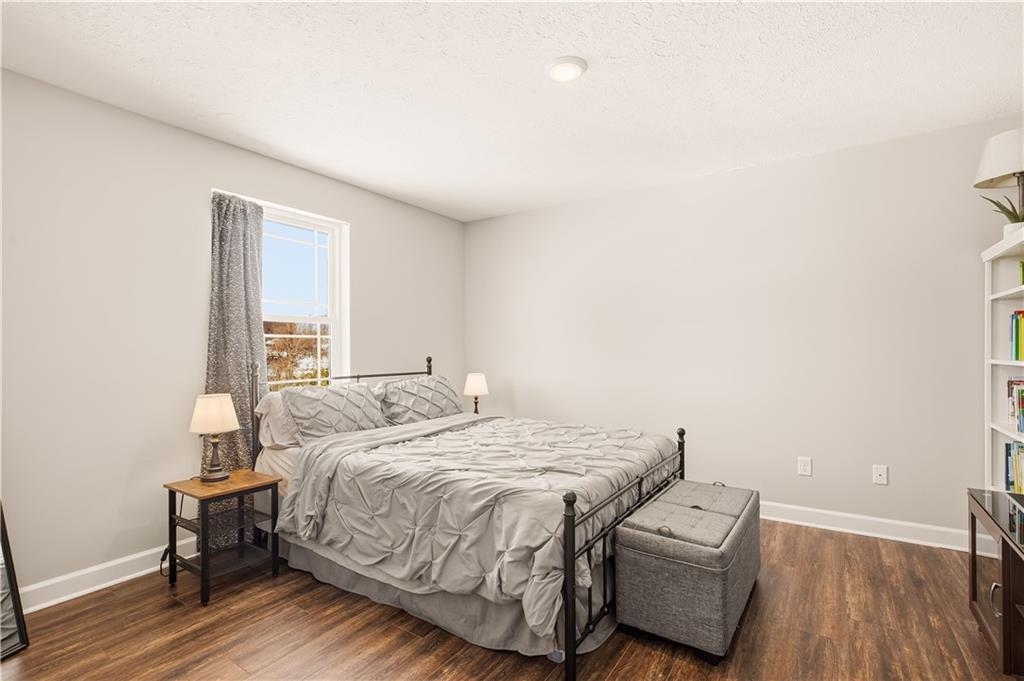 3106 Upper Ridgeview Road Connellsville, PA 15425 - Photo 29 of 44 a bedroom with a bed and wooden floor