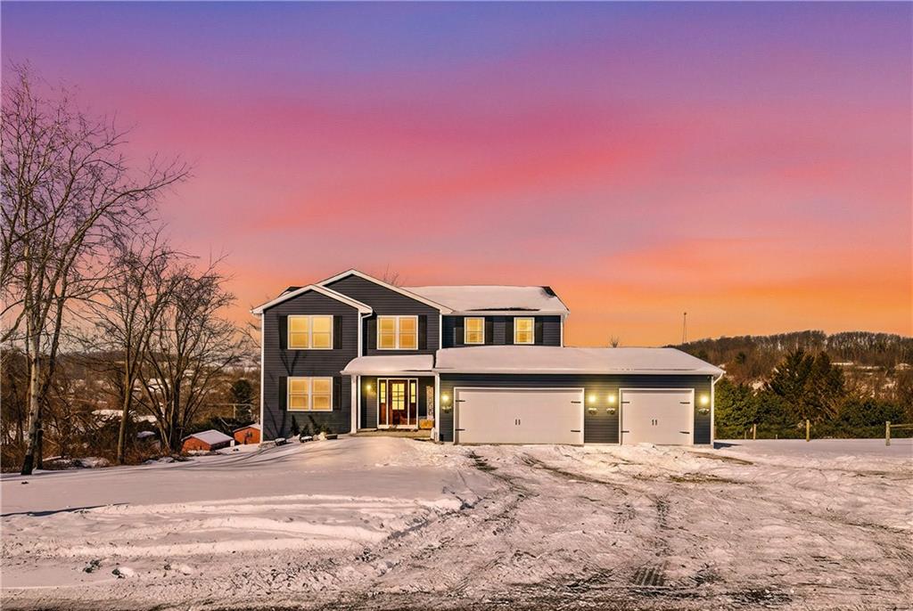 3106 Upper Ridgeview Road Connellsville, PA 15425 - Photo 5 of 44 a front view of a house with a yard and garage