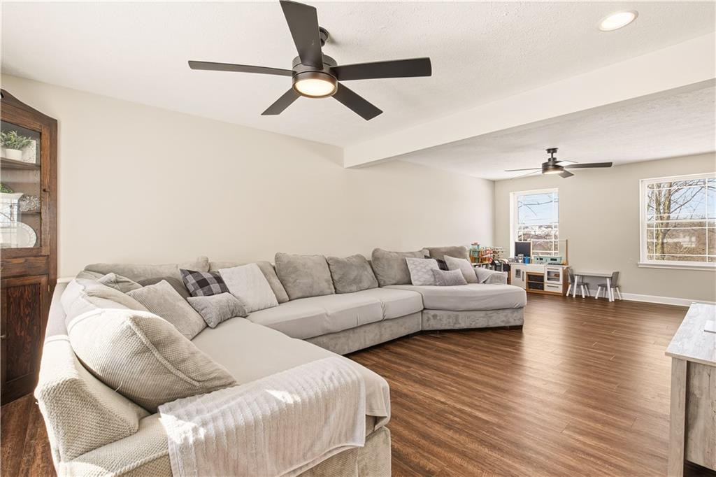 3106 Upper Ridgeview Road Connellsville, PA 15425 - Photo 6 of 44 a living room with furniture and a wooden floor