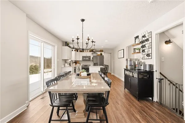 a view of a dining room with furniture window and wooden floor