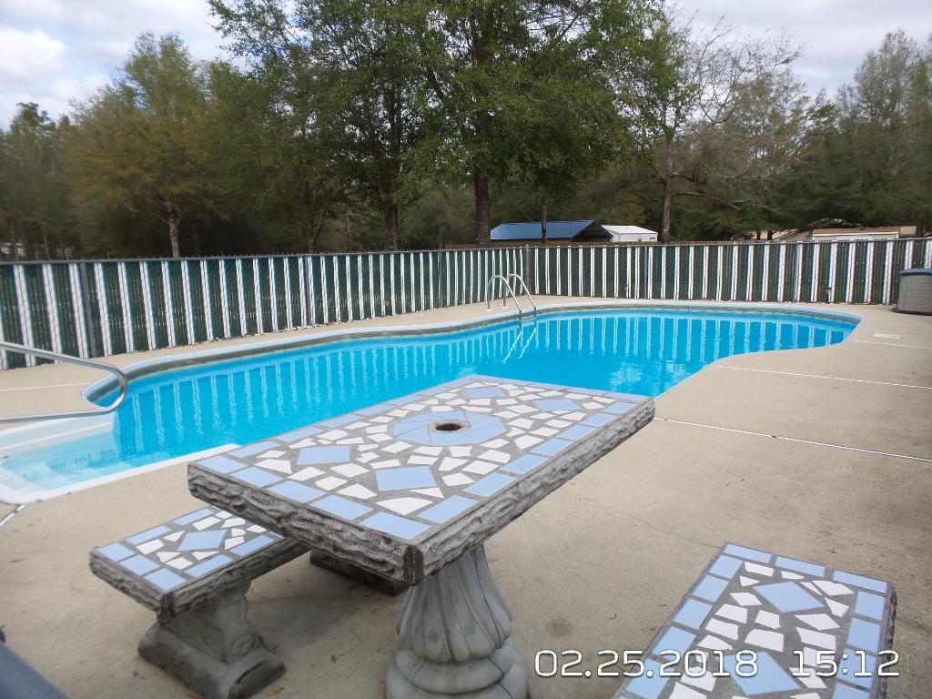 3807 Poverty Creek Road Crestview, FL 32539 - Photo 22 of 27 a view of a wooden roof deck
