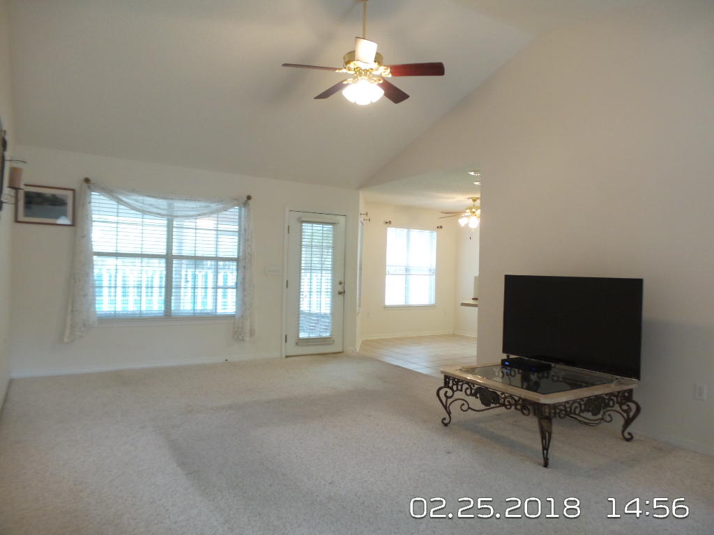 3807 Poverty Creek Road Crestview, FL 32539 - Photo 4 of 27 a living room with furniture and a flat screen tv