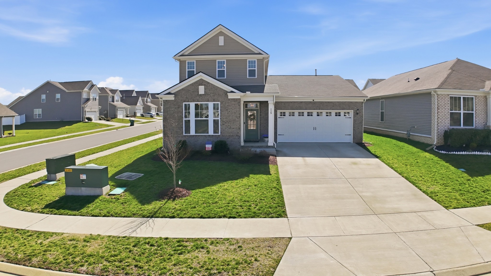 a front view of a house with a yard