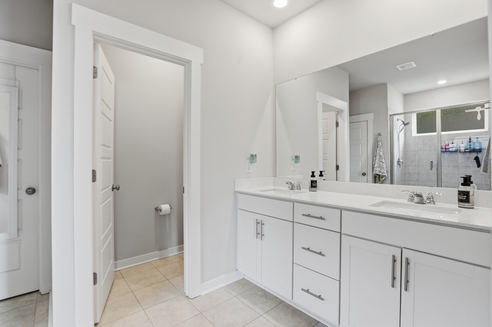 129 Merion Way Lebanon, TN 37087 - Photo 12 of 38 a bathroom with double sink and a mirror