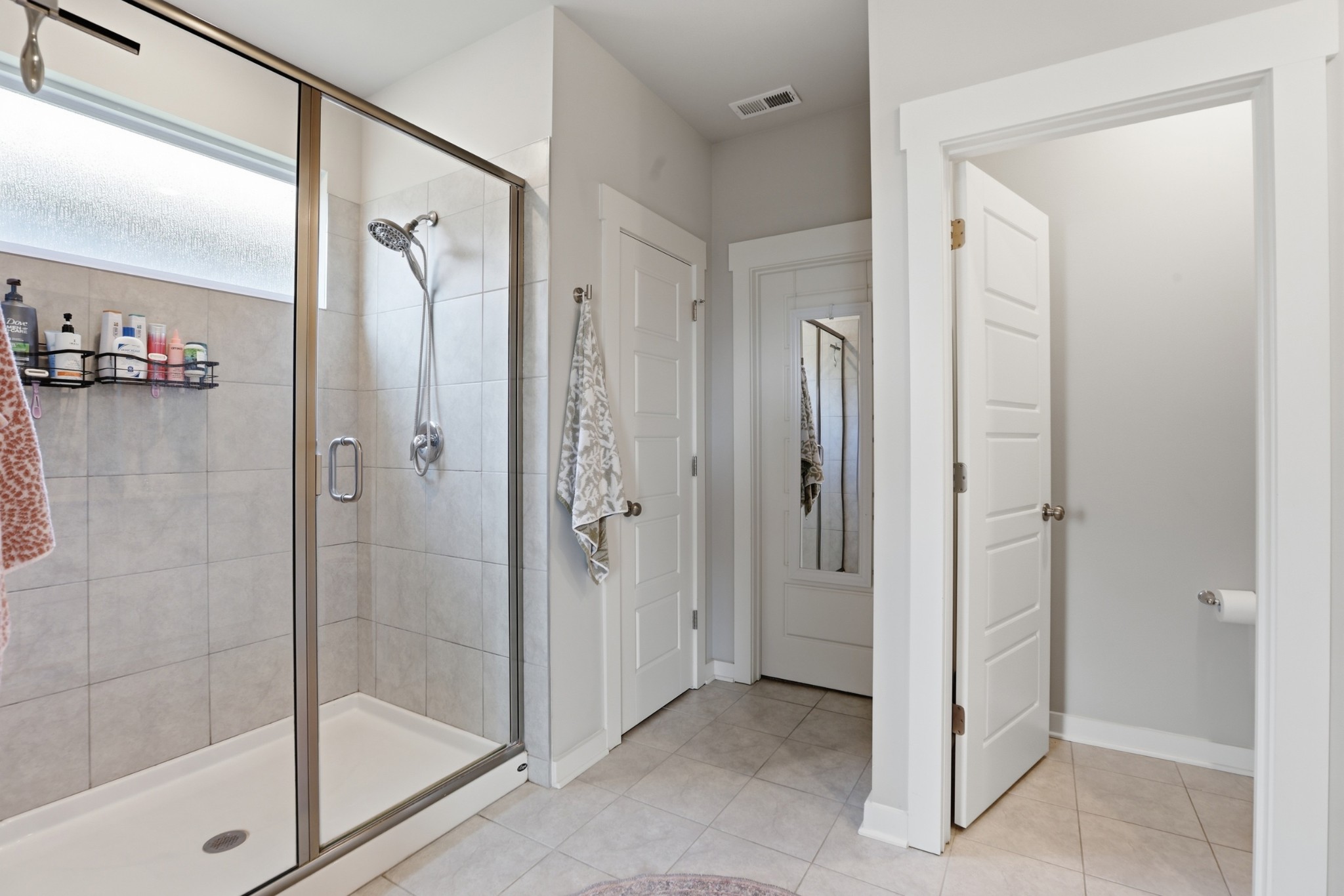 129 Merion Way Lebanon, TN 37087 - Photo 13 of 38 a bathroom with a shower and a glass door