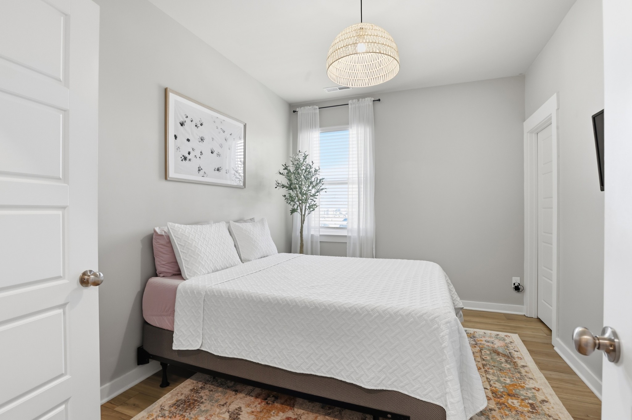 129 Merion Way Lebanon, TN 37087 - Photo 22 of 38 a bedroom with a large bed and a chandelier