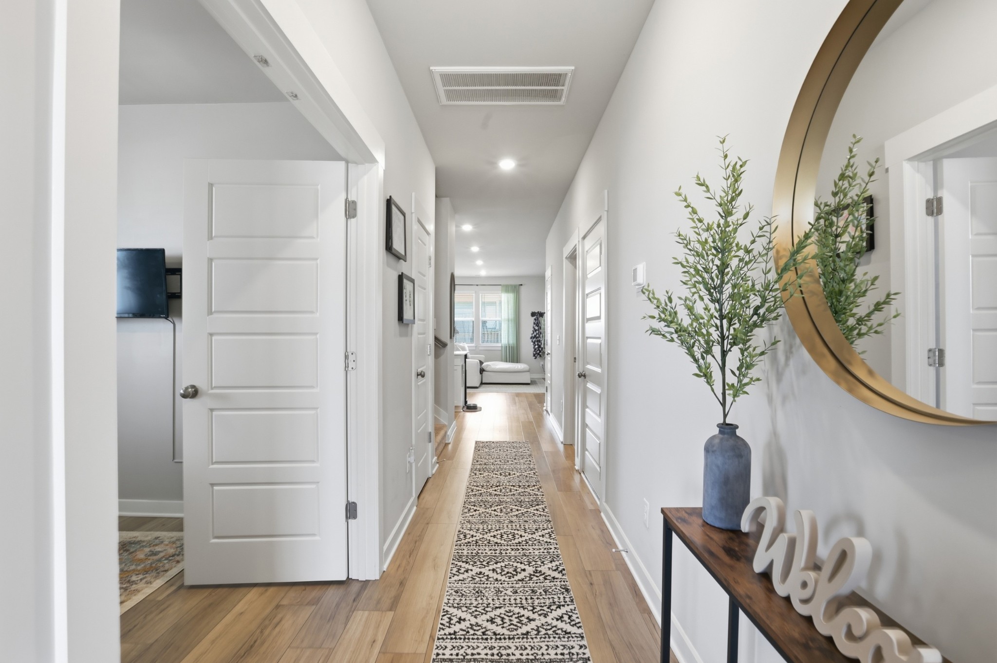 129 Merion Way Lebanon, TN 37087 - Photo 3 of 38 a view of a hallway view with wooden floor and staircase