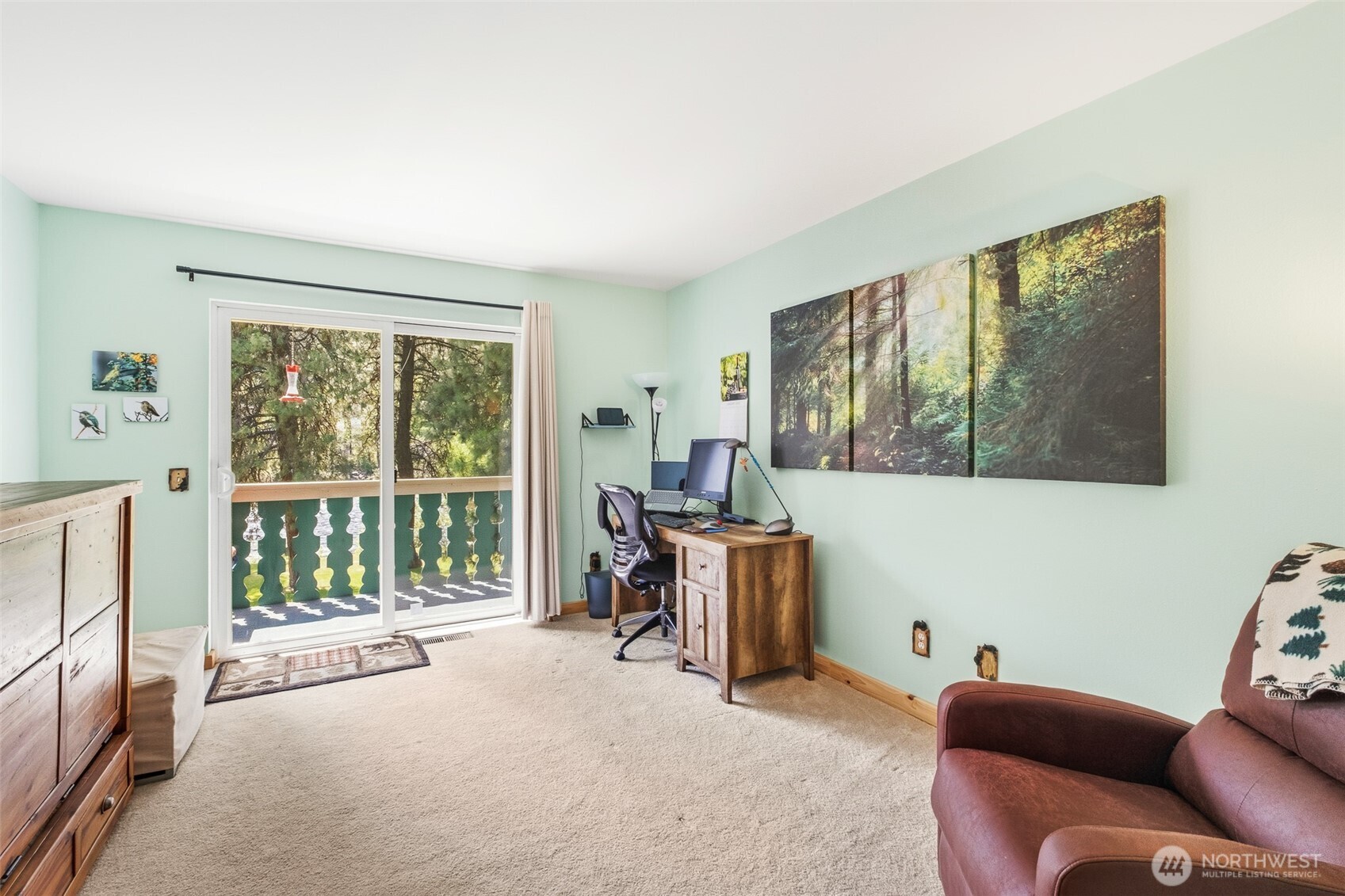 8348 Main Street, Unit 1 Peshastin, WA 98847 - Photo 23 of 40 a living room with furniture and a flat screen tv