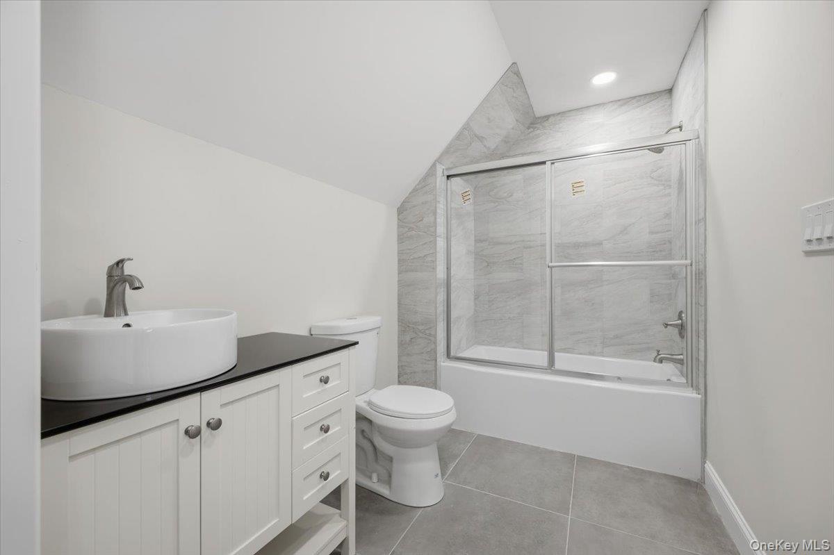 196 Fawn Hill Road Prattsville, NY 12468 - Photo 42 of 48 a bathroom with a granite countertop sink a toilet and shower