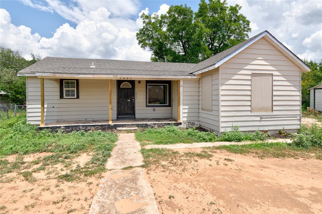 3001 Old Anson Road Abilene, TX 79603 - Photo 2 of 16 Single-story residence featuring light-colored siding, an inviting front porch with wood columns, and a dark entry door with an arched transom
