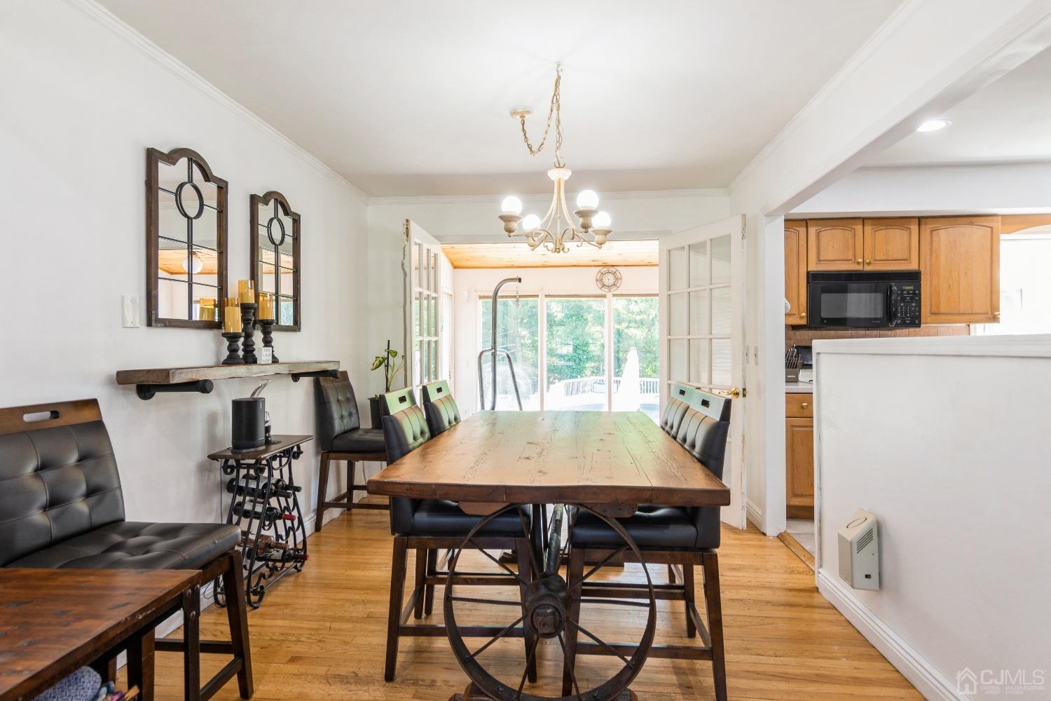 141 Overbrook Road Piscataway, NJ 08854 - Photo 12 of 38 a view of a dining room with furniture window and wooden floor