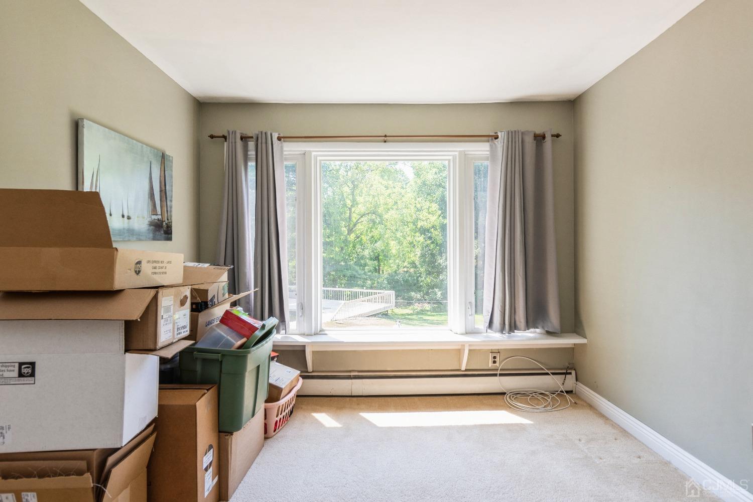 141 Overbrook Road Piscataway, NJ 08854 - Photo 21 of 38 a bedroom with a bed and a window