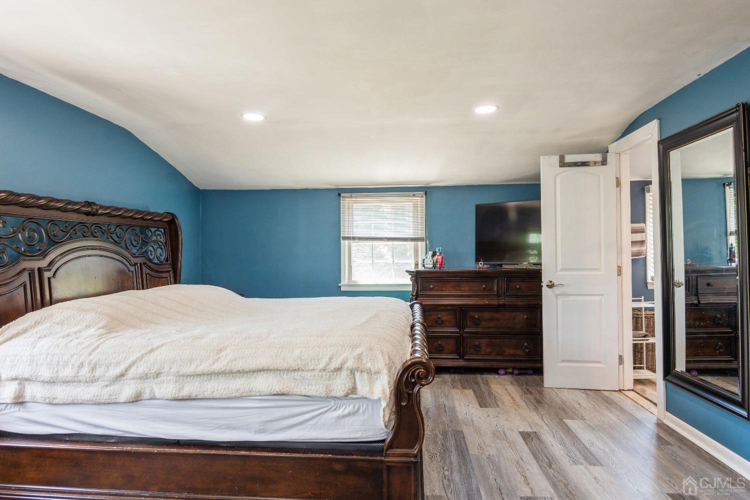 141 Overbrook Road Piscataway, NJ 08854 - Photo 24 of 38 a bedroom with a bed and wooden floor