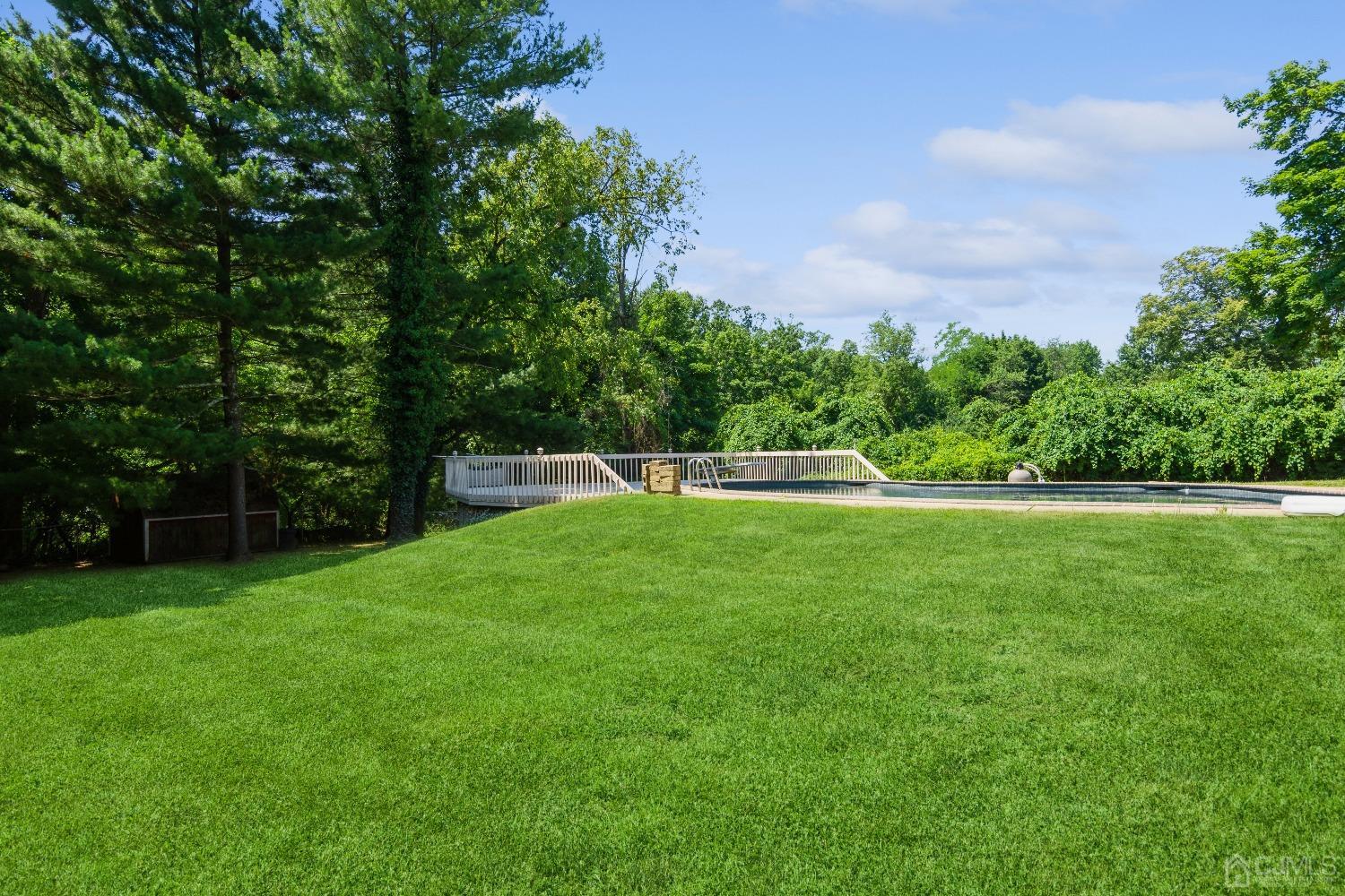 141 Overbrook Road Piscataway, NJ 08854 - Photo 5 of 38 a view of a field of grass and trees