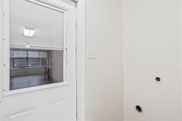 a bathroom with a glass shower door