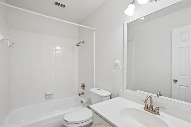 a view of a kitchen with wooden floor and a fireplace