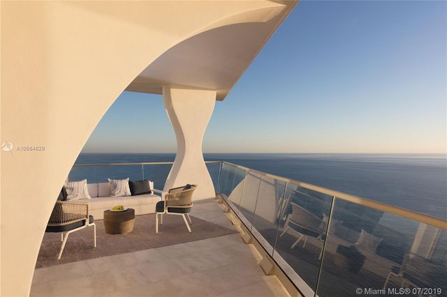 a view of living room with furniture and white walls