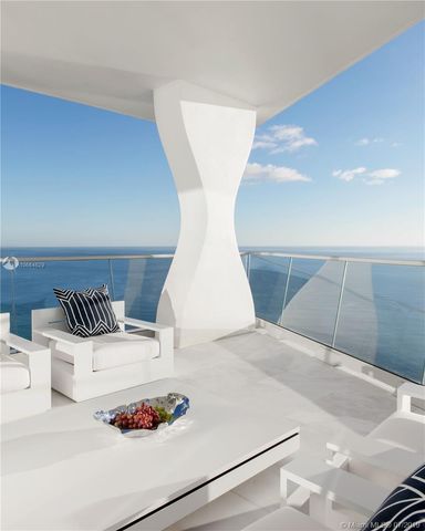 a view of kitchen with furniture and white appliances
