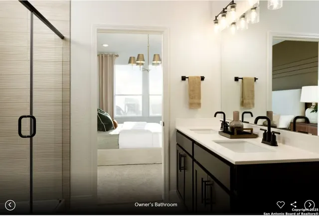 a bathroom with a sink vanity granite tub shower and a mirror
