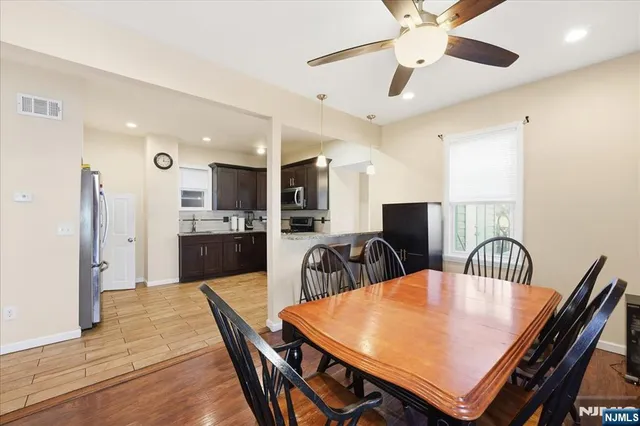a dining room with furniture and window