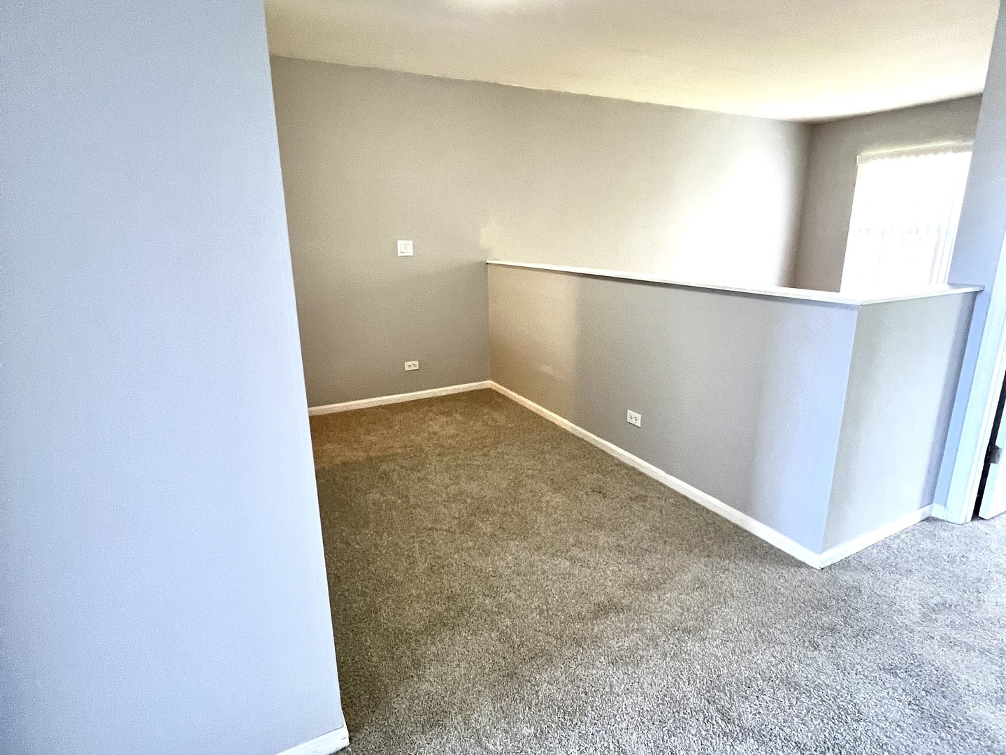 17716 Horseshoe Lane, Unit 3 Gurnee, IL 60031 - Photo 11 of 12 an empty room with a window