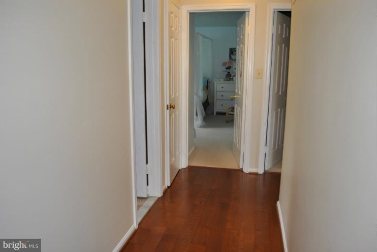 15317 Peach Orchard Road Silver Spring, MD 20905 - Photo 16 of 30 a view of a hallway with a livingroom