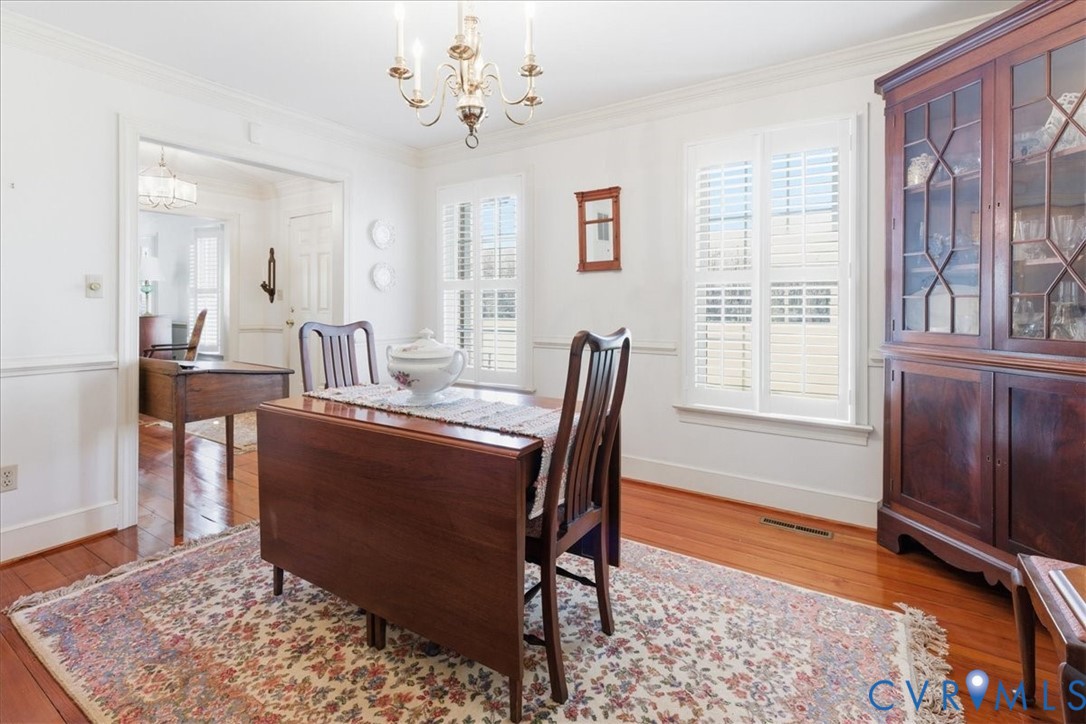 37023 Old Wakefield Road Wakefield, VA 23888 - Photo 11 of 51 a view of a dining room with furniture window and wooden floor