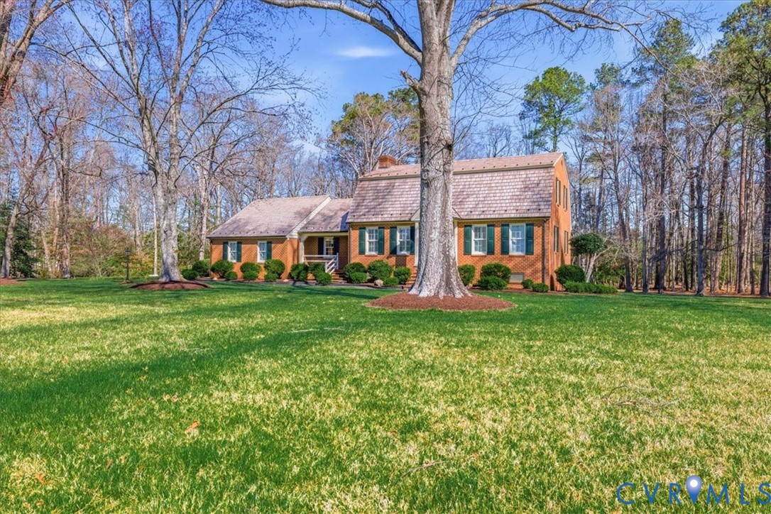 37023 Old Wakefield Road Wakefield, VA 23888 - Photo 3 of 51 a view of a house with a big yard and large trees