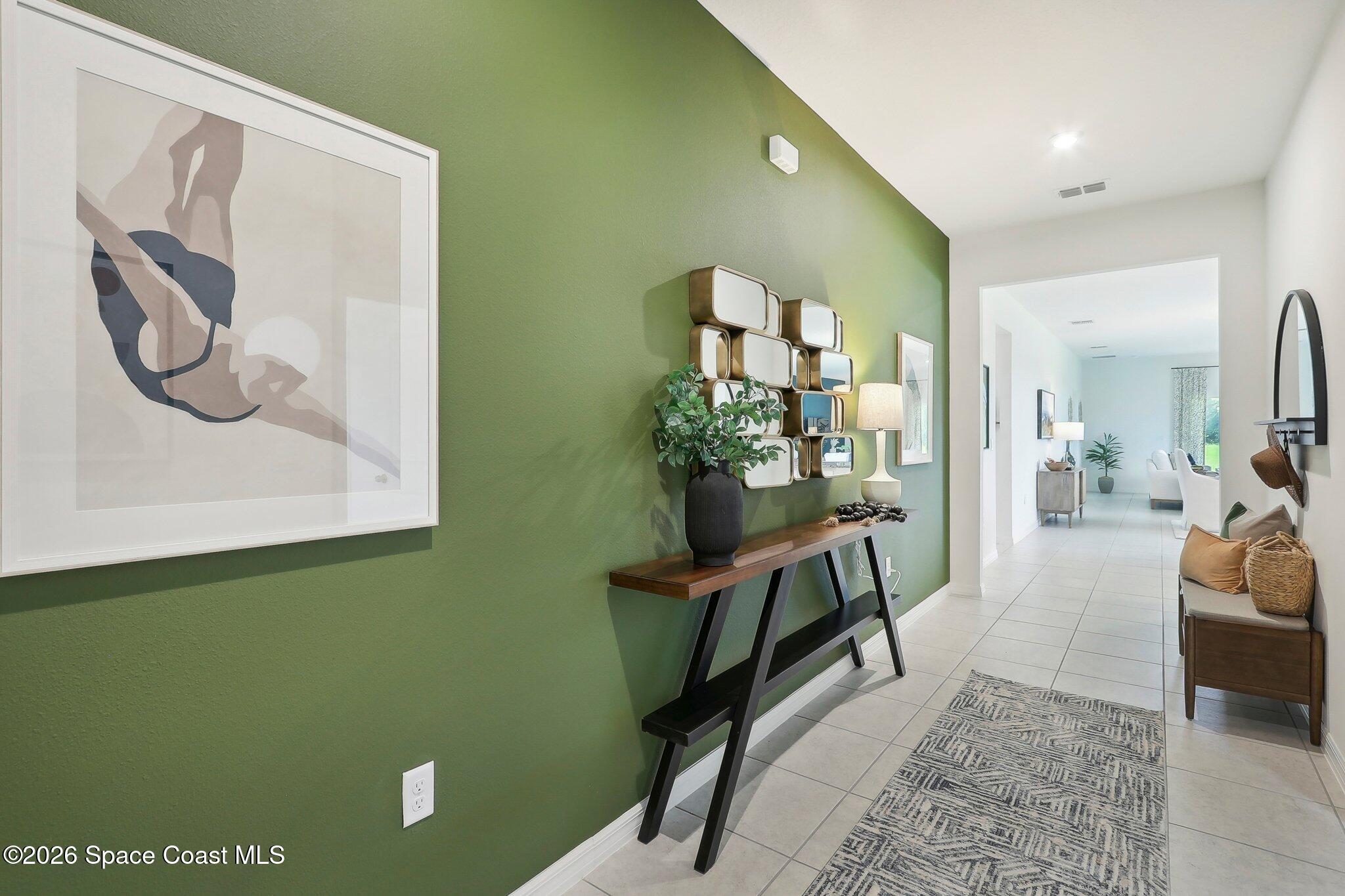 1332 Dunblane Way Northeast Palm Bay, FL 32905 - Photo 3 of 32 a view of living room with furniture and a painting on the wall