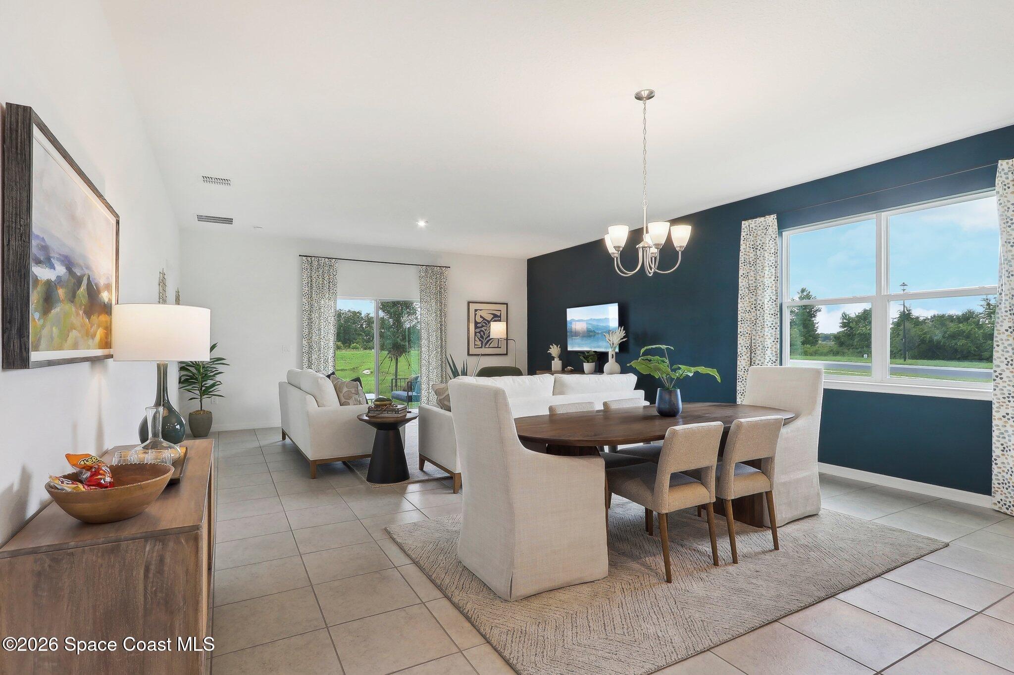 1332 Dunblane Way Northeast Palm Bay, FL 32905 - Photo 9 of 32 a view of a dining room with furniture window and outside view